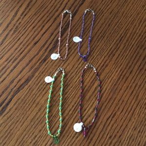 Set of four L handmade ankle bracelets